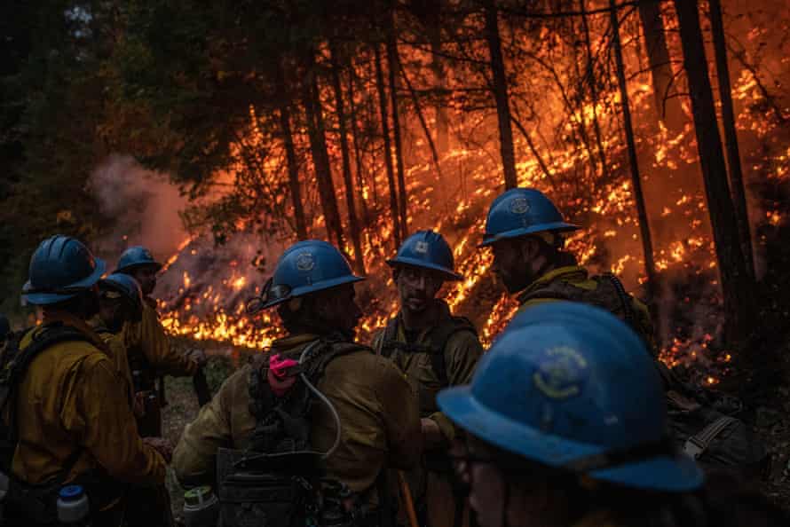 Firefighters from the Carson Hotshots regroup in Klamath national forest, after carrying out a day-long operation to help contain the Slater fire, 17 September 2020.