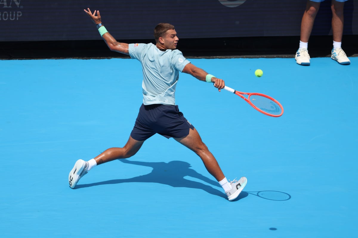 Flavio Cobolli stretches to play a backhand during his straight sets defeat against Arthur Fils in the Cincinnati Open.