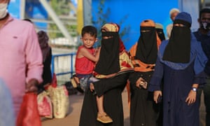 People in Bangladesh travel to their hometown after the country partly eased a more than two-month lockdown on 31 May.