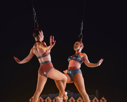 Two women hanging by their hair in a circus act