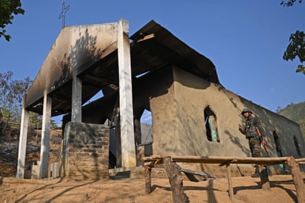 A soldier inspects a burnt-out church in Senapati district, Manipur state.