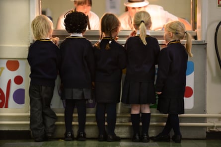 little children at school canteen counter