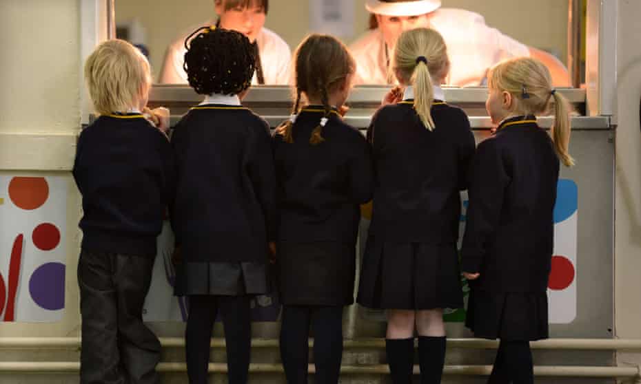 Schoolchildren queuing for breakfast at a Newcastle primary school. In England as a whole, fewer than a quarter of those receiving free school meals go on to university