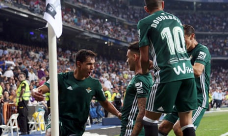 Real Betis players congratulate Antonio Sanabria, centre, after his dramatic late strike.