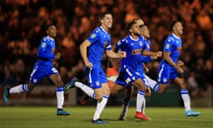 Colchester United players enjoy the moment as they knock Tottenham Hotspur out of the League Cup.