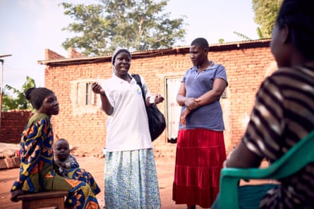 In Mbale, Amina Musenero, a health volunteer, meets community members