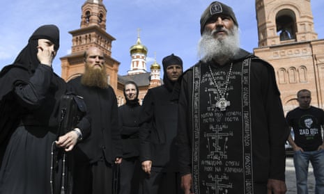 Father Sergiy speaks to journalists outside Sredneuralsk monastery near Ekaterinburg in the Urals in June.