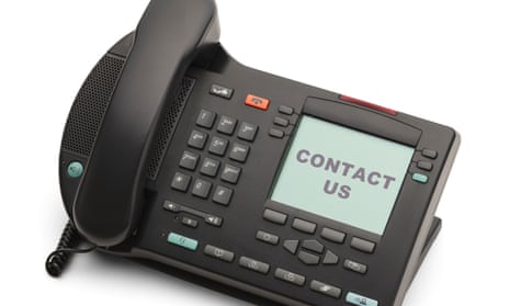 A telephone with the words 'Contact Us' on the screen.