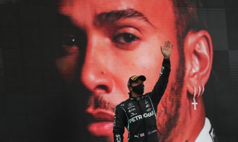 Lewis Hamilton celebrates after winning in Portugal, his 92nd grand prix success.