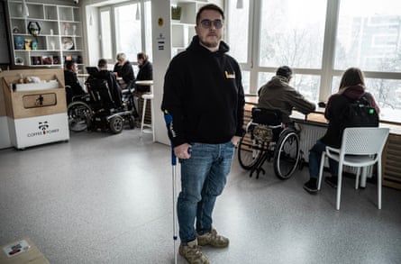 Illia Dmytryshyn holding a crutch.