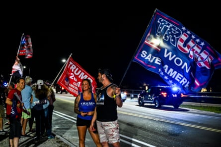 Supporters of Donald Trump protest near his Mar-a-Lago Club in Palm Beach, Florida, on 30 March.