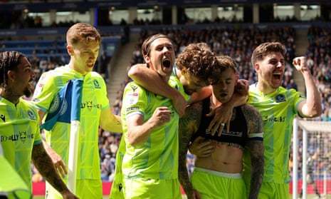 Blackburn Rovers midfielder Sammie Szmodics (second right) is congratulated by his teammates after opening the scoring against Leicester City.