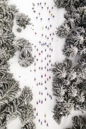 Sport. First classified: Falling Skiers by Daniel Koszela  An aerial view of competitors at the annual Bieg Piastów ski tournament held in Szklarska Poręba in March. Skiers whiz by in their colourful clothing on a track flanked by snow-covered trees