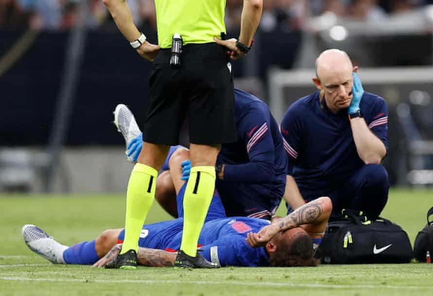 England's Kalvin Phillips receives medical attention after sustaining an injury.