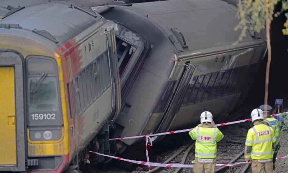Firefighters at the scene of a crash involving two trains near the Fisherton tunnel between Andover and Salisbury in Wiltshire. 