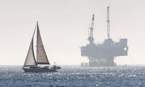 An oil drilling rig is off the Pacific Ocean coastline: Seal Beach, California.