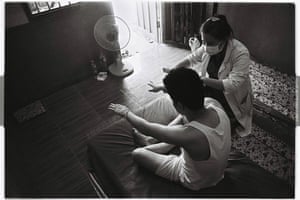 A doctor assesses a patient who has survived a drug overdose in the one public specialised mental health facility in Laos