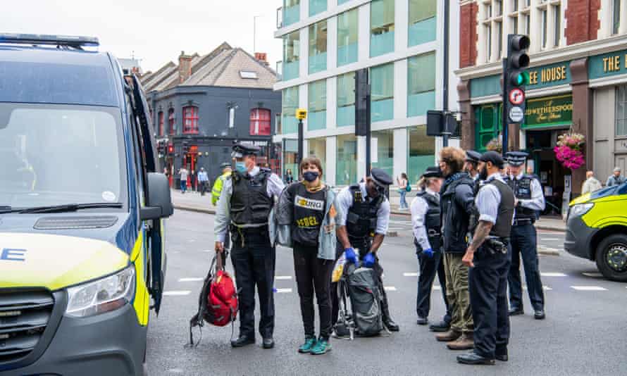 Protesters are arrested by police at the junction of Tower Bridge Road and Tooley Street, London.