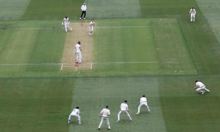 Australia’s Pat Cummins celebrates the wicket of England’s Zak Crawley who was caught by Cameron Green (bottom right).