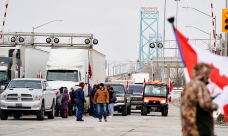 Covid live: Italy and Spain to ease mask mandate; UK records 66,183 new cases – as it happened 3 Supporters of the so-called ‘Freedom Convoy’ against the Covid-19 vaccine mandate block traffic in the Canada-bound lanes of the Ambassador Bridge border crossing, in Windsor, Ontario.