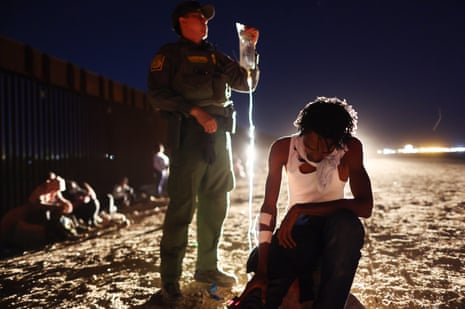 A guard treating an immigrant at the southern border, Arizona, US