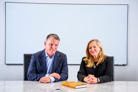 Michael Rey and Oriana Zill de Granados seated at a table with their book in front of them