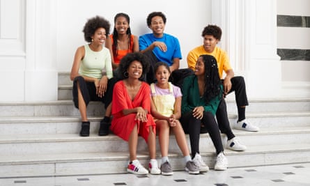 The Kanneh-Mason siblings, Konya, Jeneba, Sheku, Braimah, Aminata, Mariatu and Isata, sitting on a stone staircase