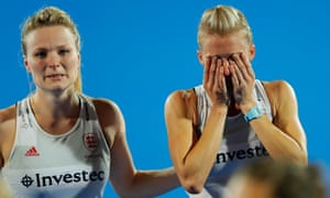Hollie Pearne-Webb, left, consoles her captain Alex Danson after Englandâs defeat.