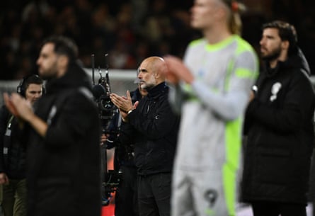 Guardiola and his players applaud the travelling City fans at Bournemouth, where a 1-1 draw handed the Premier League title to Arsenal