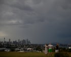 NSW storms leave man dead and thousands without power as temperatures soar into 30s