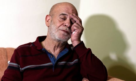 Suheil Hamwi, who spent 32 years in prison in Syria and returned to Lebanon after the government of Bashar Assad was toppled, reacts as he sits inside of his home in Chekka, Lebanon.