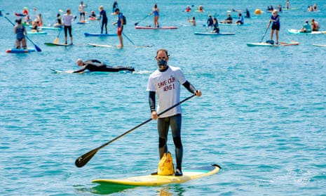 A paddle boarder at the Surfers Against Sewage stage a protest in Brighton on Saturday.