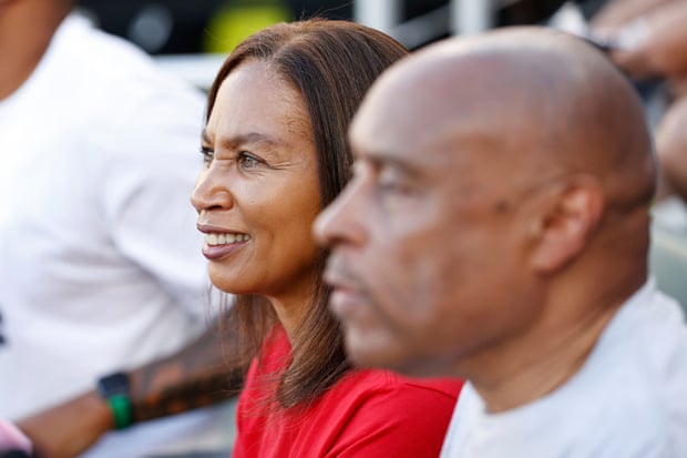 Marlean and Paul Felix, Allyson’s parents, look on after the medal ceremony