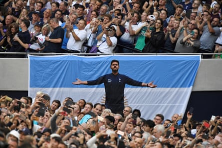 An Argentina flag with a picture of the then-Tottenham manager Mauricio Pochettino printed on it.