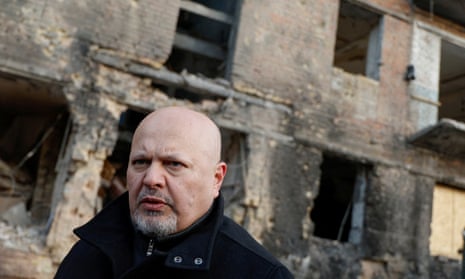 The ICC prosecutor, Karim Khan, visiting a residential building damaged by a Russian missile strike near Kyiv in February.