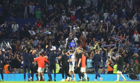 Brighton fans celebrate at full time as their 1-1 draw with Manchester City means their team qualify for next season’s Europa League.
