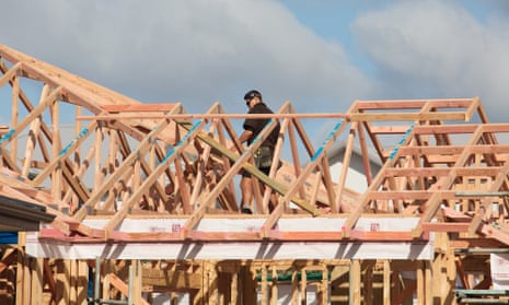 Man working on housing construction site