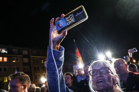 Supporters of the far-right Alternative for Germany (AfD) party attend an election rally in Cottbus, Germany, on September 19, 2024.