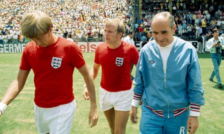 Alf Ramsey, right, leaving the field with Colin Bell, left, and Francis Lee after the quarter-final match against West Germany at the 1970 World Cup.