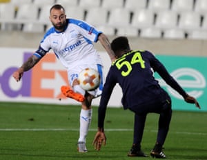 Apollon Limassol’s Fotis Papoulis shoots past Everton’s Beni Baningime.