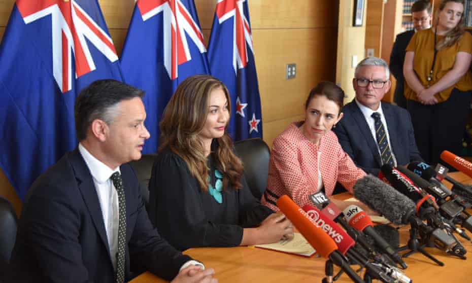 From left to right: New Zealand Green party co-leaders James Shaw, Marama Davidson, prime minister Jacinda Ardern and Kelvin Davis sign a cooperation agreement in November 2020.