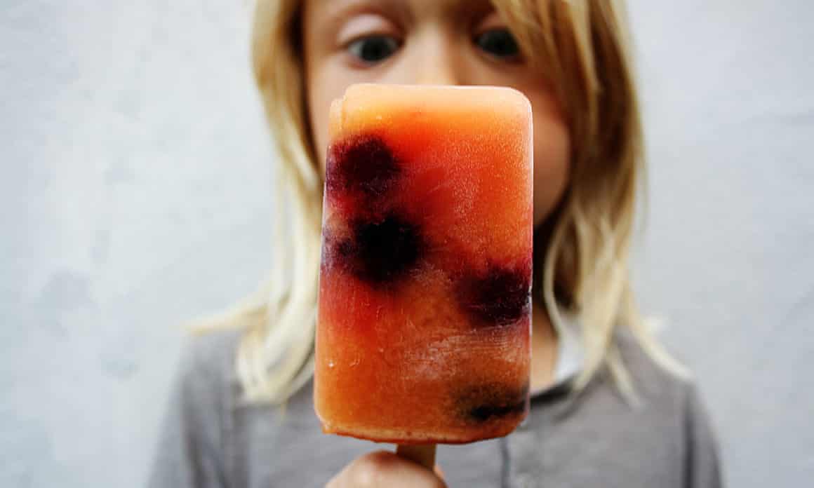 A child eating a popsicle