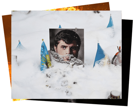Portraits of fallen Ukrainian and foreign fighters lie blanketed in snow in Kyiv.
