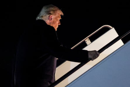 Donald Trump boards Air Force One as he departs for Asia