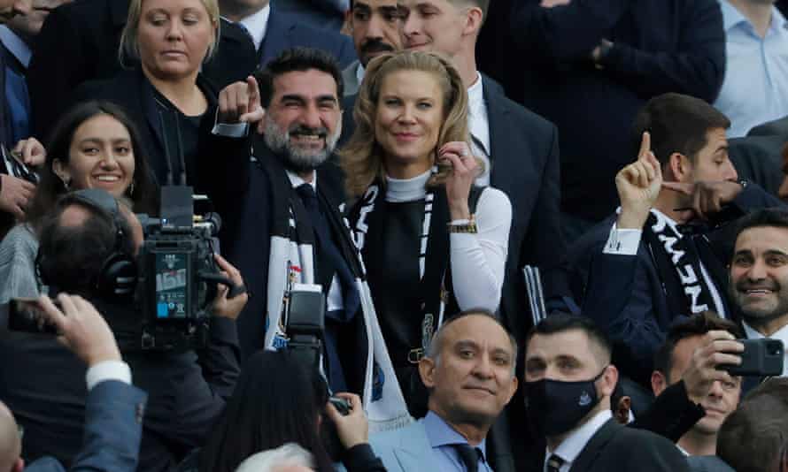 The new non-executive chairman Yasir al-Rumayyan (pointing) and director Amanda Staveley after they walk into the directors box.