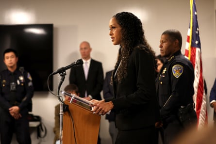 woman speaks behind podium