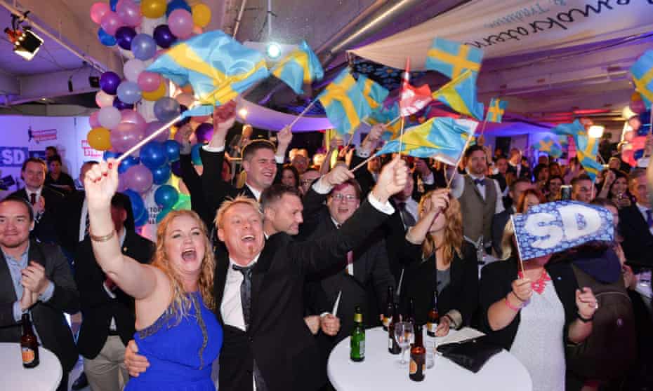 Supporters of the far-right Sweden Democrats wave Swedish flags and celebrate in Stockholm after the party made major gains at the last general election in 2014