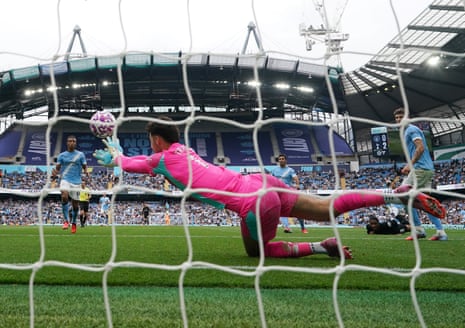 Manchester City goalkeeper James Trafford makes a save from Tottenham Hotspur's Wilson Odobert.