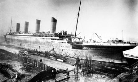 black and white photo of RMS Titanic at the shipyard