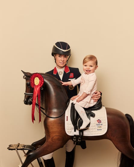 Charlotte Dujardin with Isabella, one, who is sitting on a rocking horse.